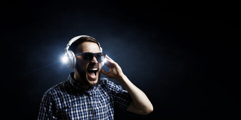 Young man with headphones . Mixed media