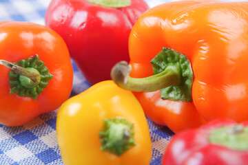 Yellow orange and red capsicum on white background 
