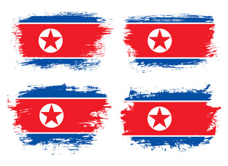 Artistic North Korea country brush flag collection. Set of grunge brush flags on a solid background