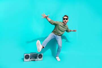 Full length photo of crazy cheerful clubber man dance discotheque 90s event wear pullover isolated blue color background