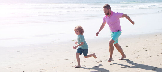 Father and son run on summer beach outdoor, banner poster with copy space, childhood and parenting....