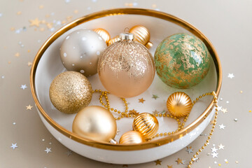 Mixed new year decorations in festive holiday dish