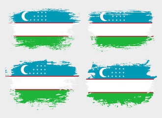 Artistic Uzbekistan country brush flag collection. Set of grunge brush flags on a solid background