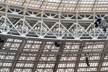 Close up view of metal structure frame of roof of large building. Construction of the stadium roof.