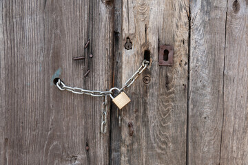 A double wooden door chained closed