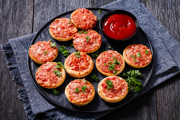 mini pizzas with ham and pecorino cheese, top view