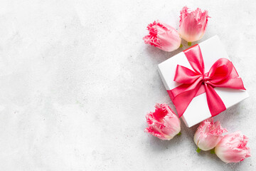 Fototapeta na wymiar Happy Mothers day. Pink flowers with white gift box