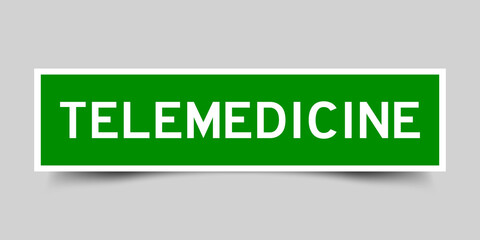 Green color square shape sticker label with word telemedicine on gray background