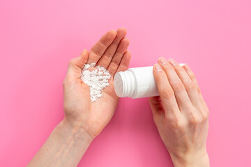 Fototapeta na wymiar Applying white talcum powder on hand. Skin care cosmetic