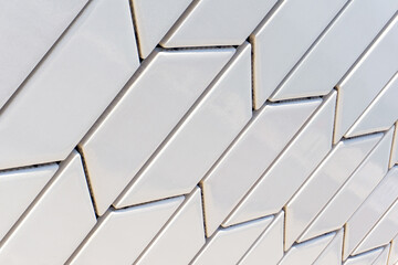 Angled white tile pattern perspective close up