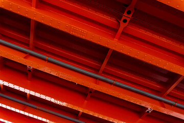 Bright orange metal base of the bridge