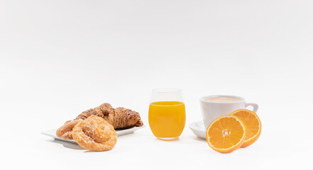 Orange juice with cup of coffee and pastries