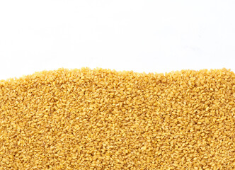close-up texture of raw bulgur with copy space for text.