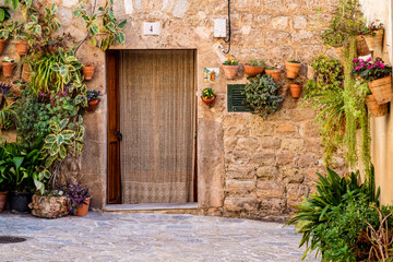 Fototapeta na wymiar macetas en una fachada, Valldemossa, Mallorca, balearic islands, Spain