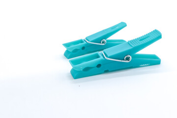 plastic clothespins blue color on white background
