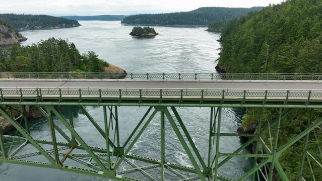 Side scrolling drone shot of Deception State Park's steel bridge.