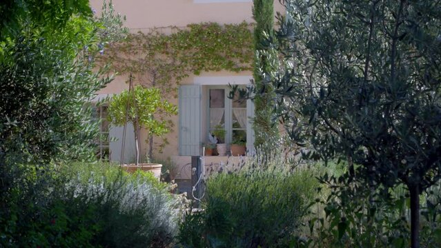 Rustic Mediterranean villa in southern France with contemplative garden and vines, Dolly left shot