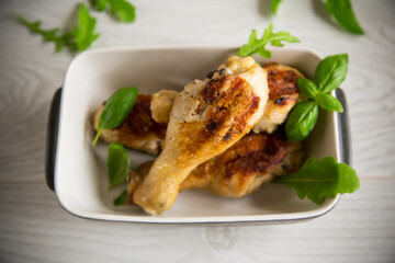 grilled chicken legs fried with spices and herbs