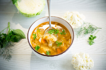 vegetable summer soup with cauliflower in a bowl