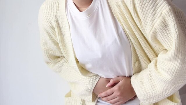 woman suffering from stomach ache, holding belly, feeling abdominal or menstrual pain or belly abdominal, diarrhea
