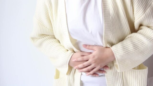 woman suffering from stomach ache, holding belly, feeling abdominal or menstrual pain or belly abdominal, diarrhea disease