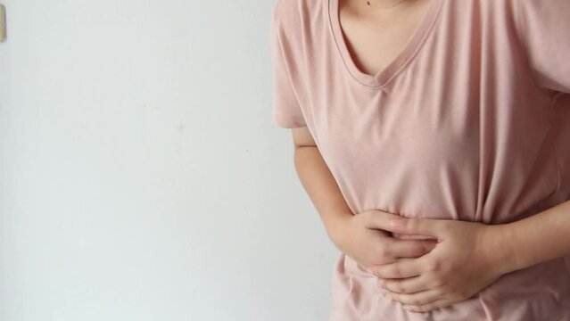 woman suffering from stomach ache, holding belly, feeling abdominal or menstrual pain or belly abdominal, diarrhea disease