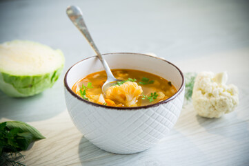 vegetable summer soup with cauliflower in a bowl