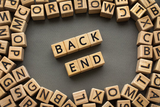 Inscription BackEnd software development concept. Wooden cubes with letters scattered blurred background