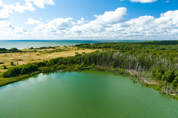 Beautiful aerial view of lake Plaze in Klaipeda district, where bird lovers can watch the lake's water birds up close.