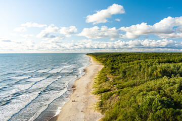 Aerial view of the Baltic Sea shore line near Klaipeda city, Lithuania. Beautiful sea coast on summer day.