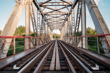 Railway bridge over the river, electric train road urban landscape