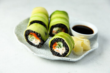 Crab sushi roll wrapped in avocado
