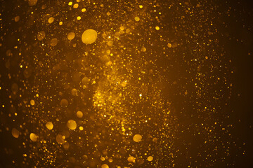Glowing golden glitter festive lights abstract bokeh background