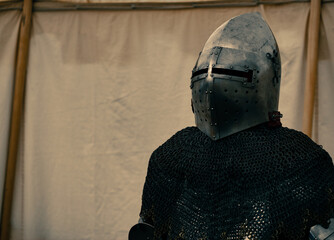 dramatic medieval plate armor scene with helmet