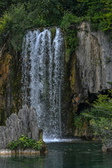 Fototapeta na wymiar Plitvice waterfall with cascading foamy water