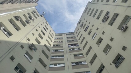 Fototapeta na wymiar Three sided apartment building low angle shot