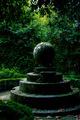 small water pond with stone sculpture