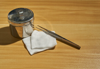 Gauze for dressing wound with jar on table