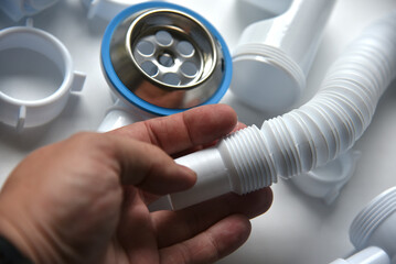 Plumbing siphon in the hands of a master