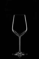 Glass goblet on black background