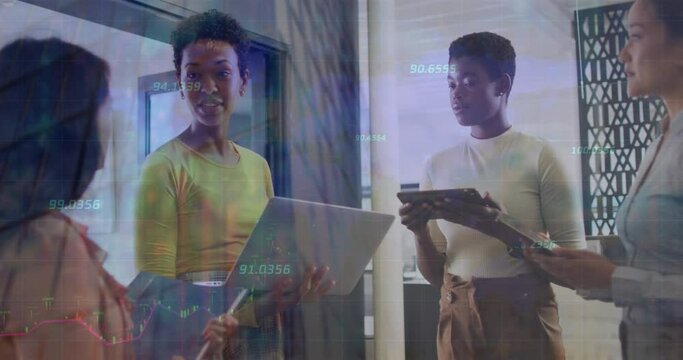 Animation of numbers over diverse female coworkers in office - Powered by Adobe