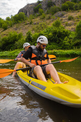 Portrait of two males getting ready to kayaking