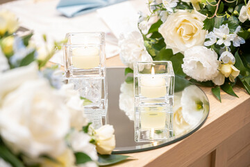 A candle on the table is on fire