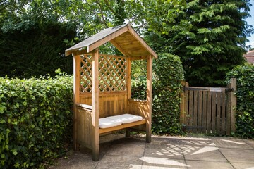 Mini wooden gazebo in the park