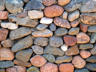 Multicolored cobblestones stone wall, good for background, seamless line.Egypt