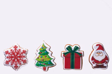 Gingerbread cookies with santa claus icing, christmas tree. gift, snowflake 