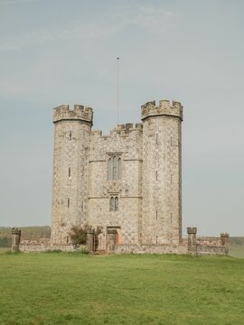 Exterior Design Of The Ancient Arundel Castle With A Garden Under Cloudy Sky