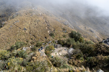 Hiking in the cloud forests and green valleys of the Inca Trail on the way to Machu Picchu in Peru