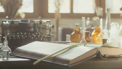 Close-up of a perfumer's workplace. Vintage cinematic concept. Sunny day in the working workshop....