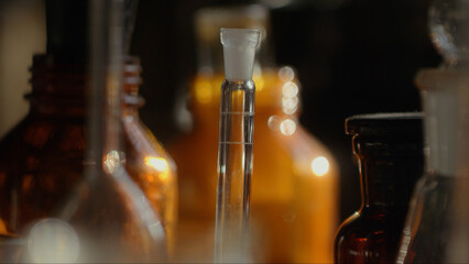 Close-up of a perfumer's workplace. Vintage cinematic concept. Sunny day in the working workshop....